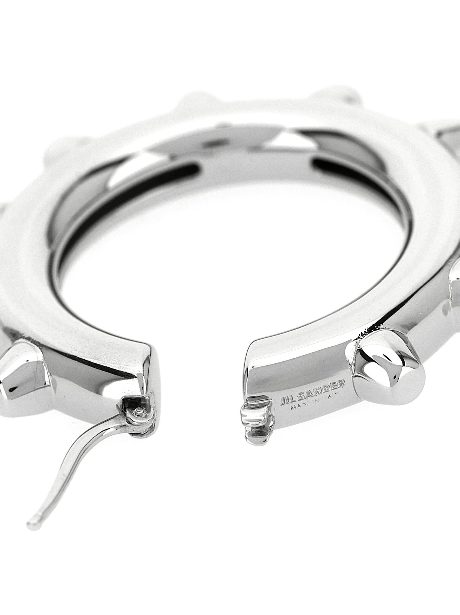 Earrings by Jil Sander for women in cotton silver & hooped features an ornate hoop from the Women's Hoop Silver Brass Earrings collection, showcasing a ornate finish that embodies sophisticated luxury.