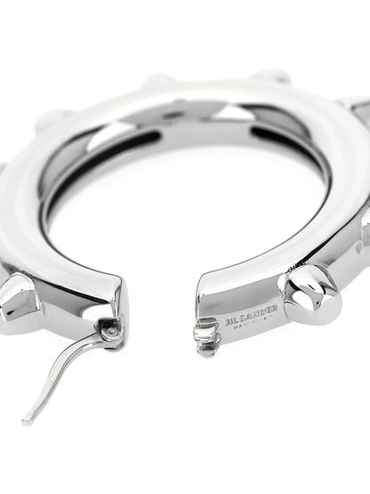 Earrings by Jil Sander for women in cotton silver & hooped features an ornate hoop from the Women's Hoop Silver Brass Earrings collection, showcasing a ornate finish that embodies sophisticated luxury.