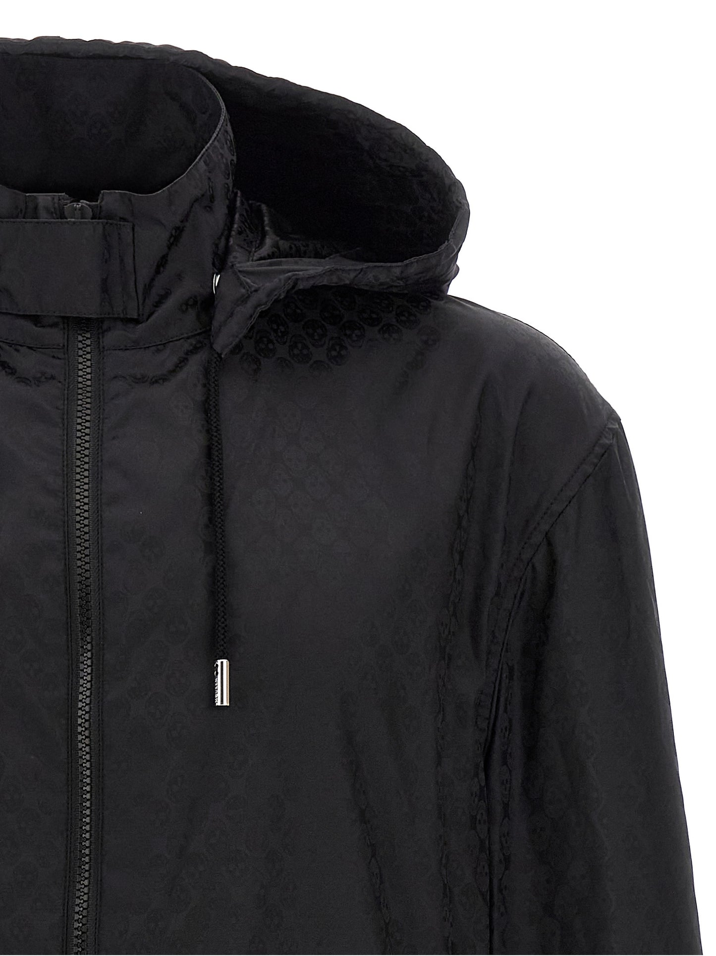 Hooded Windbreaker Jacket by Alexander McQueen for men in nylon black, patterned & jacquard showcases a modern silhouette, integrating pockets, hooded & windproof and a modern hooded high-neck neckline for a sophisticated finish.