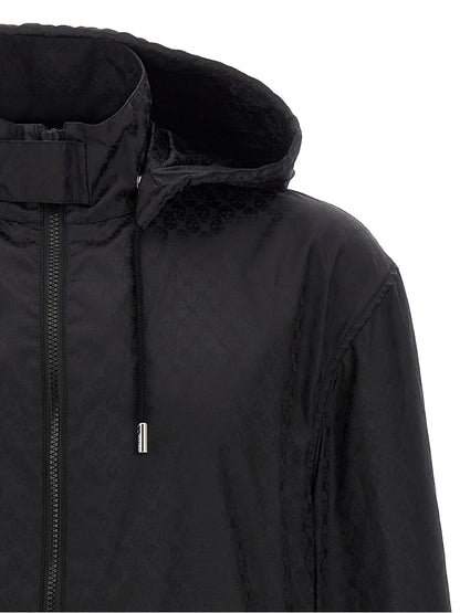 Hooded Windbreaker Jacket by Alexander McQueen for men in nylon black, patterned & jacquard showcases a modern silhouette, integrating pockets, hooded & windproof and a modern hooded high-neck neckline for a sophisticated finish.