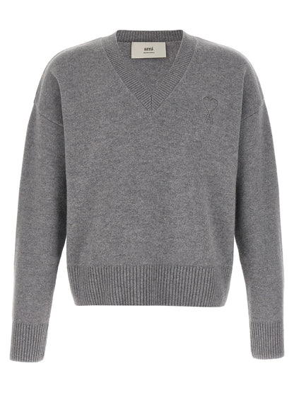 Cardigan by Ami Paris for men in cashmere gray features an impeccable silhouette, showcasing a sophisticated v-neck neckline and detail for a truly impeccable finish.