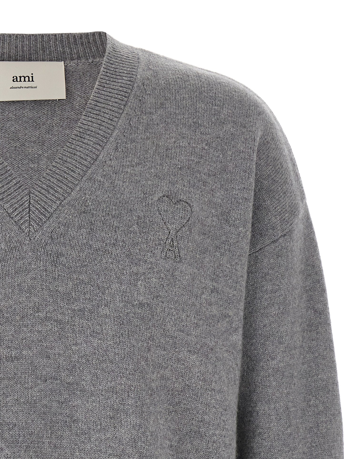 Cardigan by Ami Paris for men in cashmere gray features an impeccable silhouette, showcasing a sophisticated v-neck neckline and detail for a truly impeccable finish.