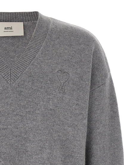 Cardigan by Ami Paris for men in cashmere gray features an impeccable silhouette, showcasing a sophisticated v-neck neckline and detail for a truly impeccable finish.