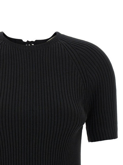Cardigan by Tory Burch for women in stretch polyamide cotton black features a dramatic silhouette, showcasing a sophisticated crew neckline and dramatic detail for a timeless, premium look.