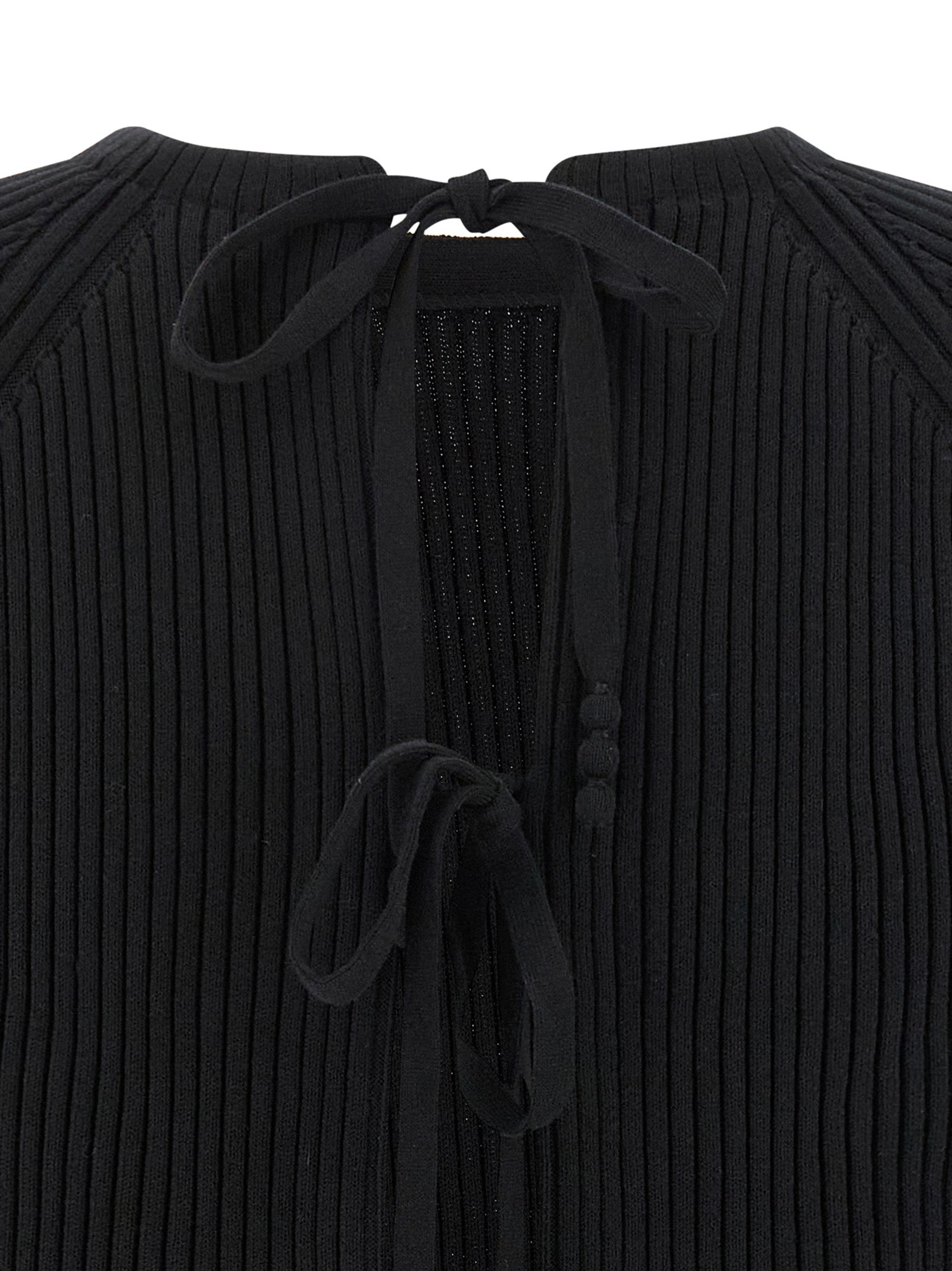 Cardigan by Tory Burch for women in stretch polyamide cotton black showcases a captivating silhouette, artfully detailed with a captivating and for a truly sophisticated captivating look.