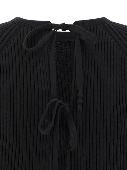 Cardigan by Tory Burch for women in stretch polyamide cotton black showcases a captivating silhouette, artfully detailed with a captivating and for a truly sophisticated captivating look.