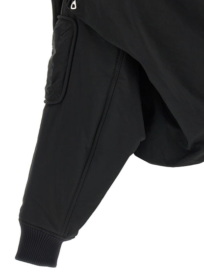 This Hooded Bomber Jacket by Jean Paul Gaultier for women in polyester polyurethane polyethylene black exhibits a edgy silhouette, meticulously detailed with functional pockets, hooded & insulated and a edgy for a edgy finish.