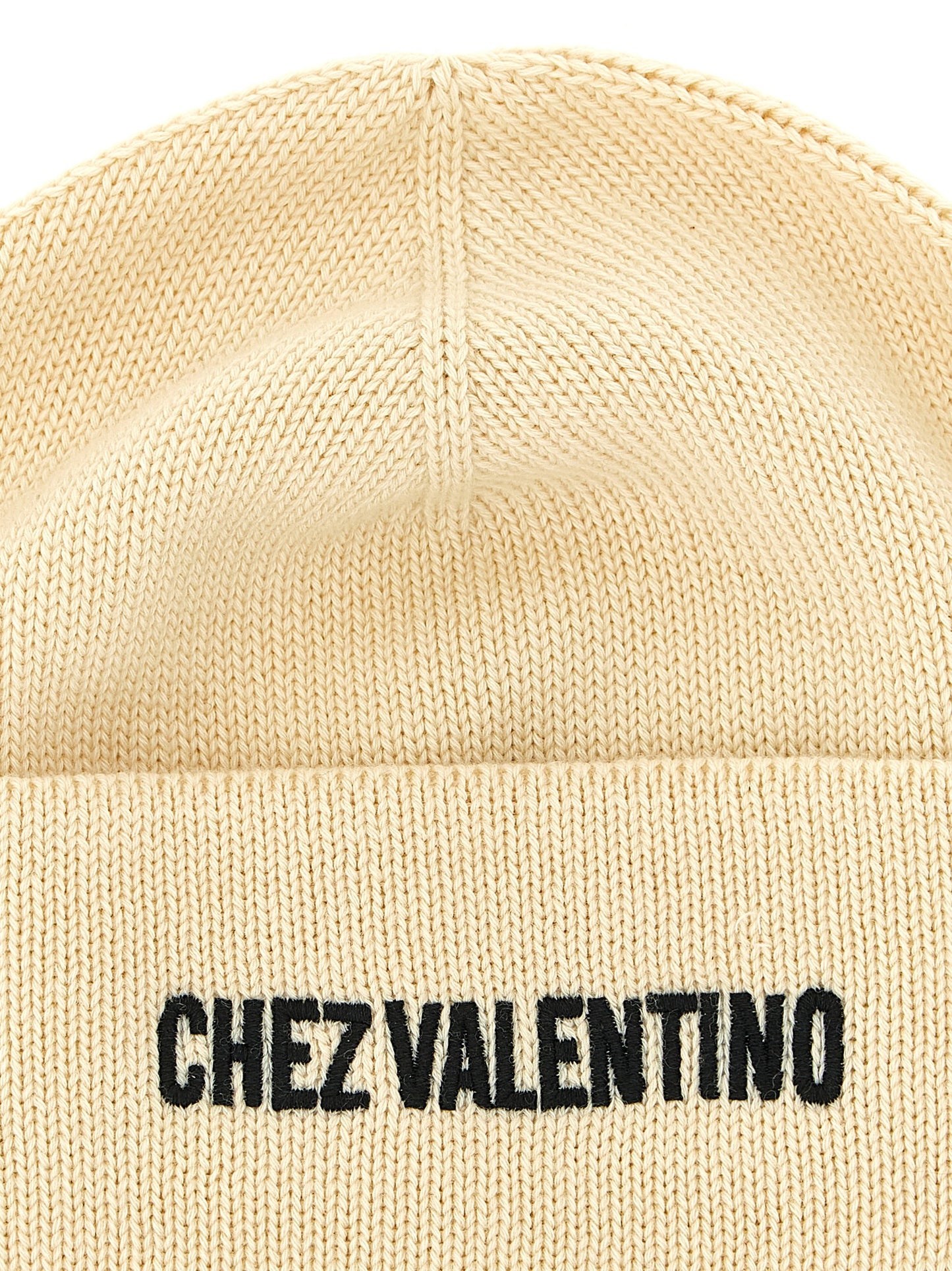 Beanie Hat by Valentino Garavani for men in virgin wool & cotton beige features a athleisure-luxe silhouette, artfully capturing the essence of the athleisure-luxe Virgin Wool & Cotton Beanie Hat design for a sophisticated look.
