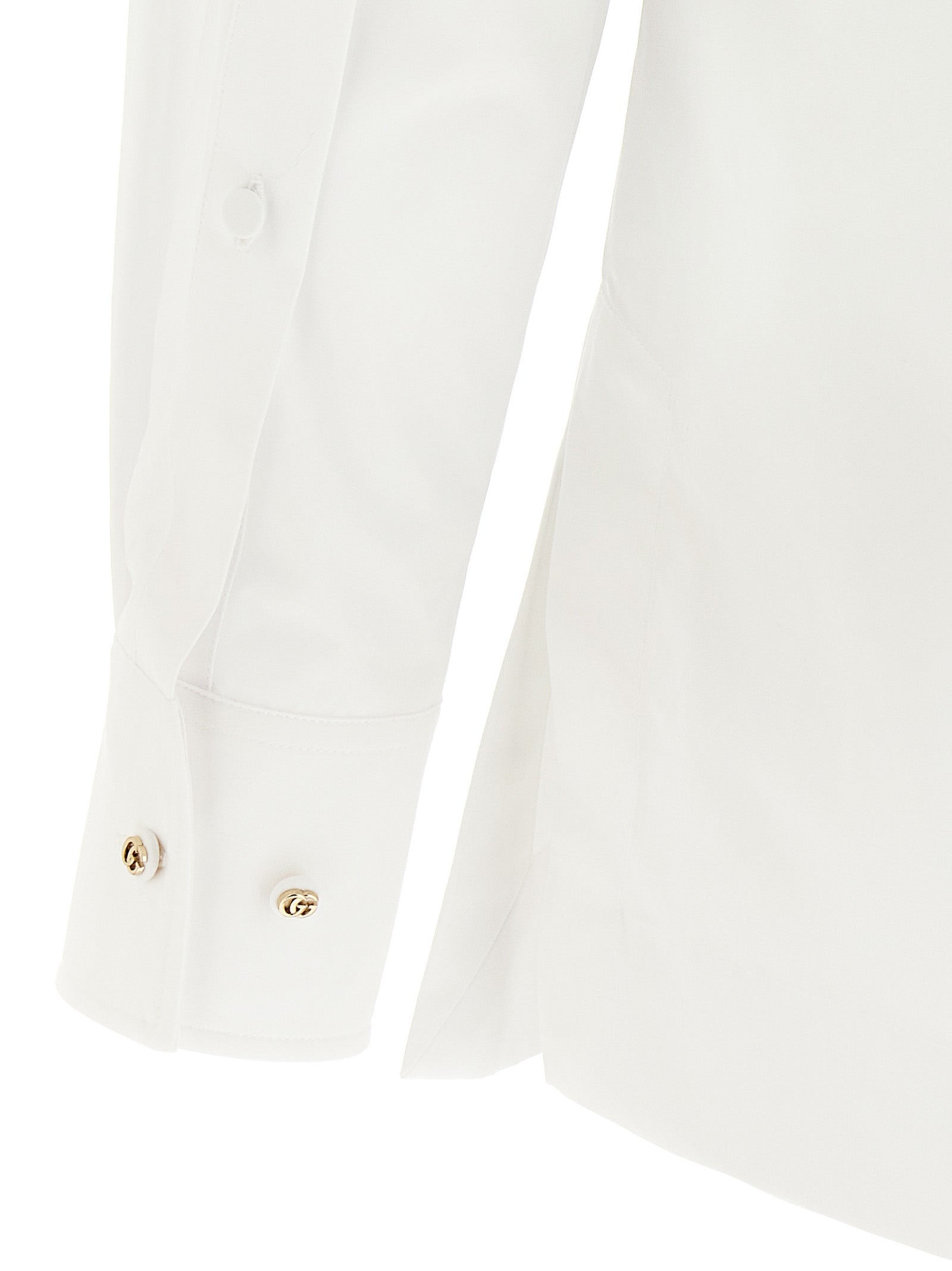 Blouse by Gucci for women in cotton white & striped features an architectural silhouette with a refined and elegant for a architectural look.
