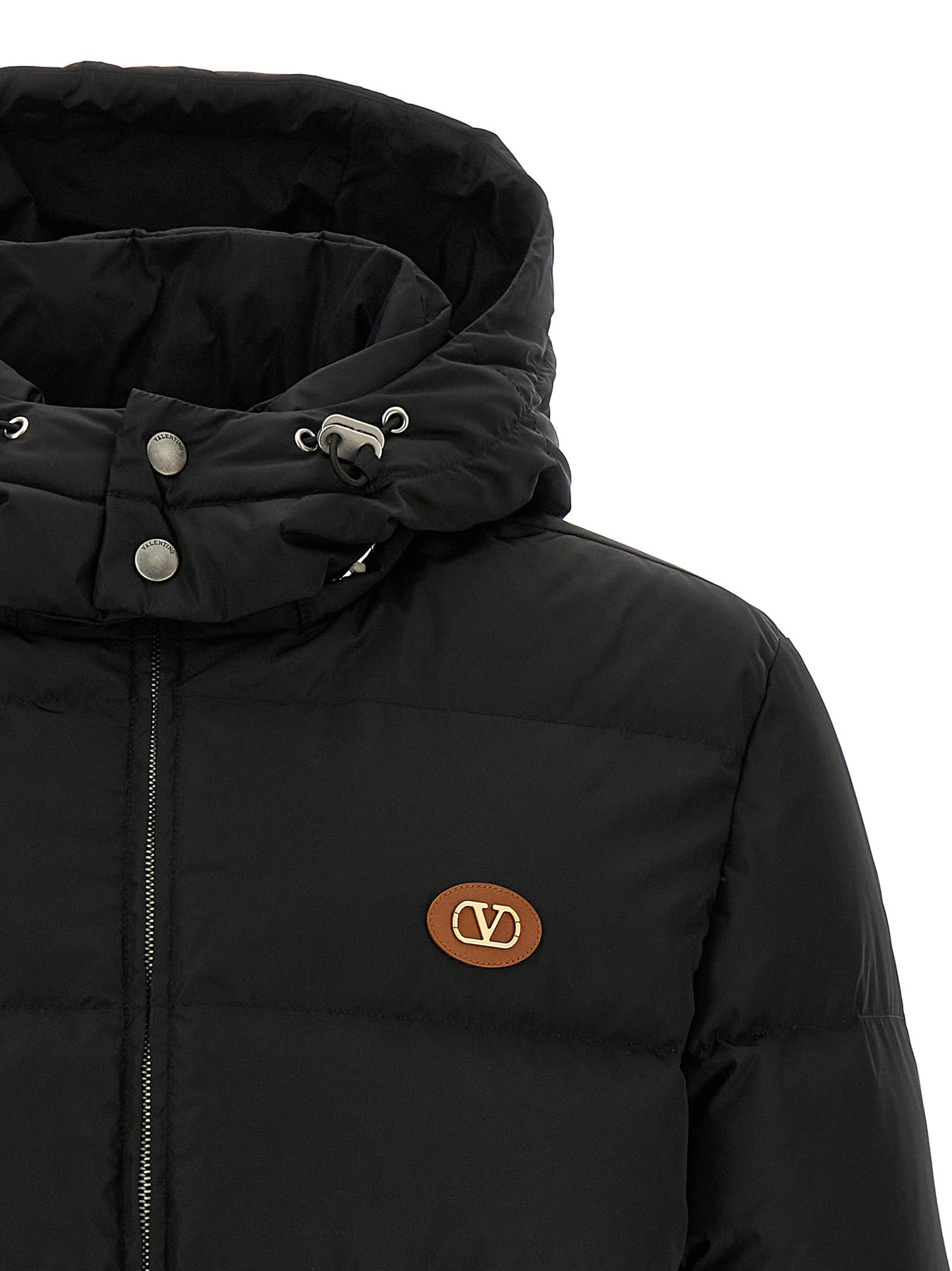 This Hooded Puffer Jacket by Valentino Garavani for men in polyamide black & signature exhibits a edgy silhouette, meticulously detailed with functional hooded & insulated and a edgy wrap hooded neckline for a edgy finish.