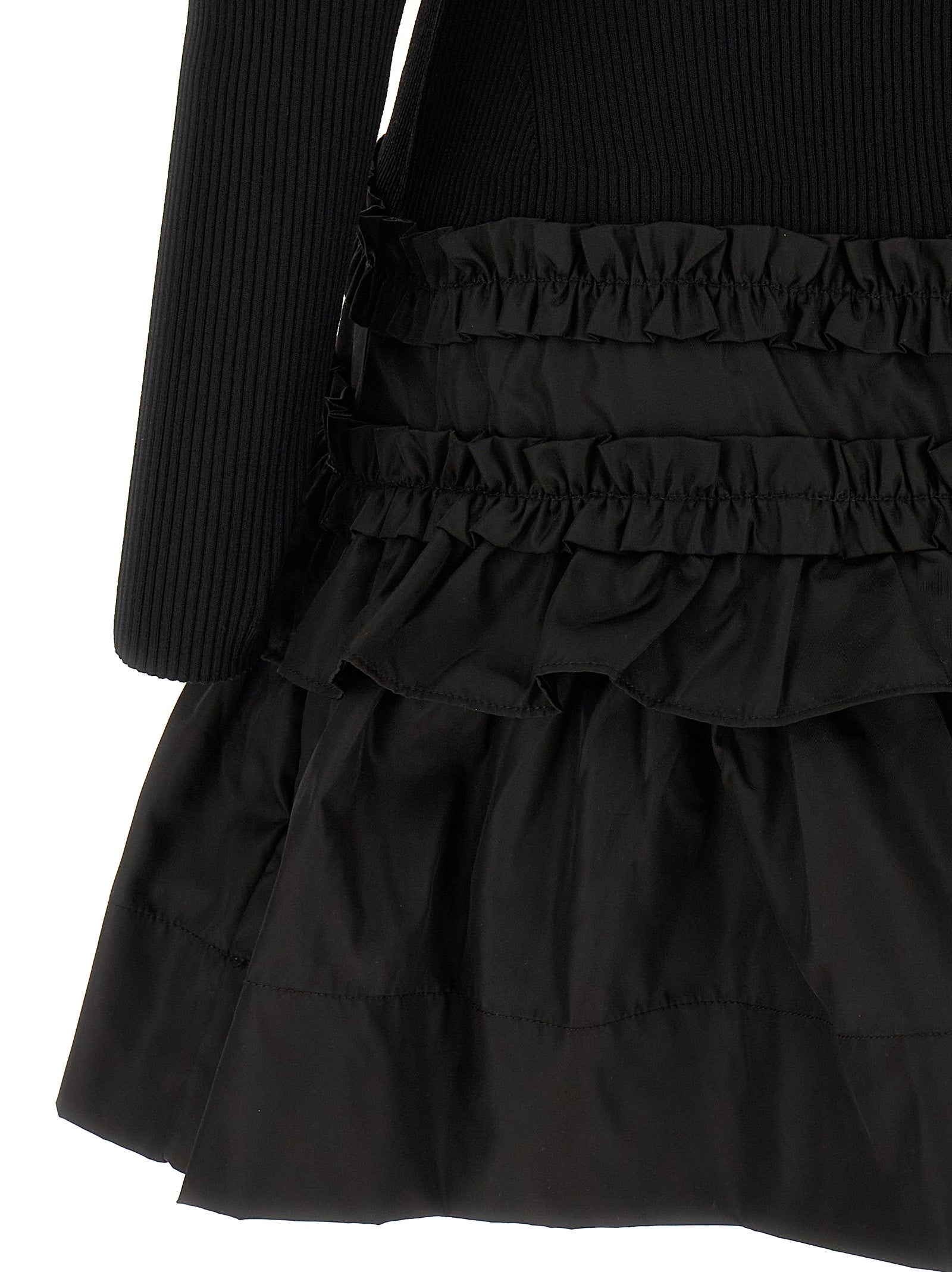 Dress by Ganni for women in stretch nylon viscose black presents a sinuous silhouette, showcasing a sophisticated and detailed with a sinuous short mini for a refined finish.