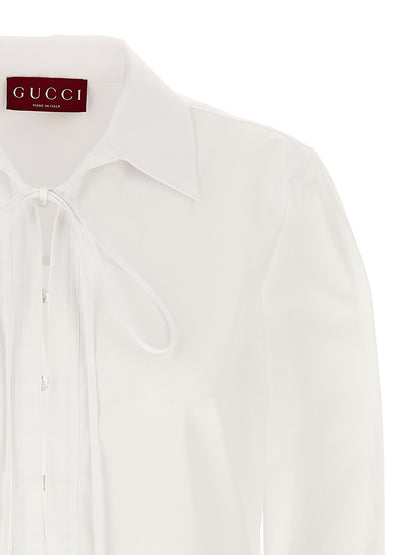Dress by Gucci for women in cotton white features an eye catching silhouette with a sophisticated , elegant , and a refined short mini for a eye catching aesthetic.