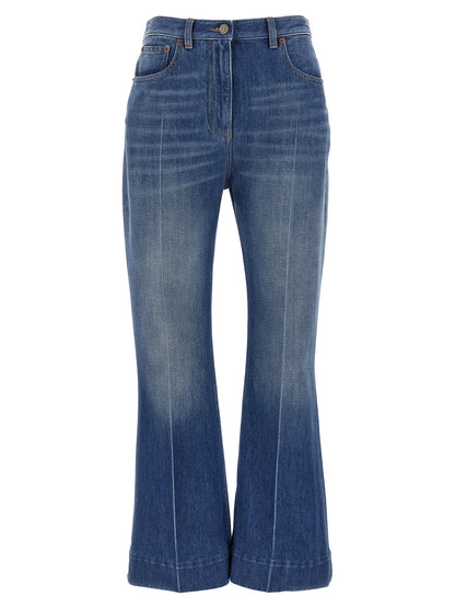 Jeans by Valentino Garavani for women in denim cotton light-blue features an sartorial flared and long with a cut for a sartorial finish.