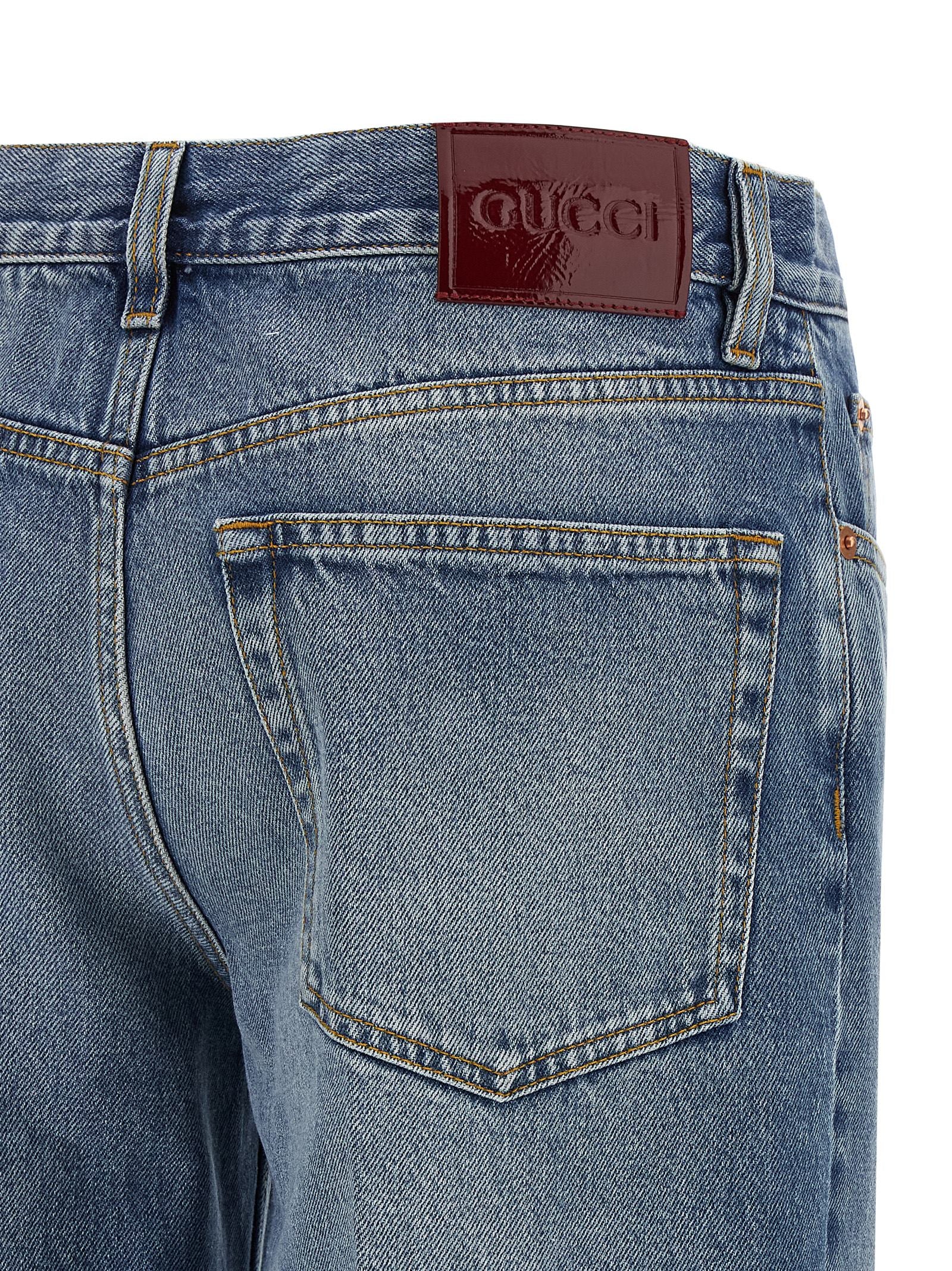 Jeans by Gucci for women in denim cotton light-blue, red & signature presents a tailored silhouette, showcasing a tailored straight-leg and long cut with a refined for a truly tailored aesthetic.