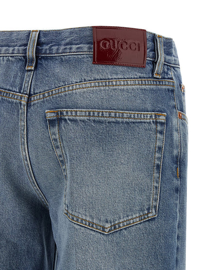 Jeans by Gucci for women in denim cotton light-blue, red & signature presents a tailored silhouette, showcasing a tailored straight-leg and long cut with a refined for a truly tailored aesthetic.