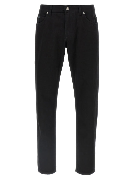 Jeans by Dolce & Gabbana for men in denim cotton black features a polished silhouette with a polished straight-leg, reaching a polished long and finished with a polished .