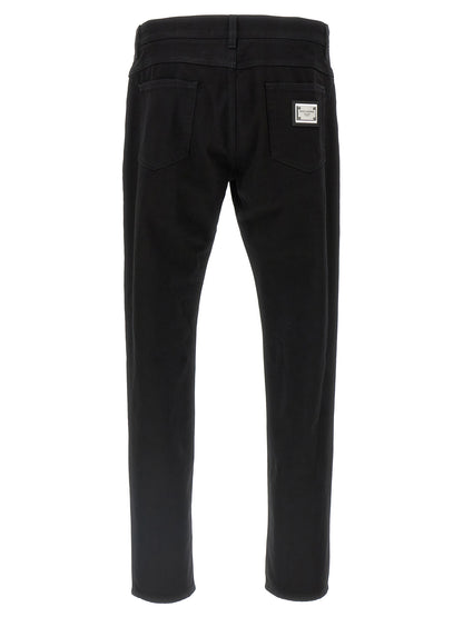 Jeans by Dolce & Gabbana for men in denim cotton black presents a refined pantology silhouette, artfully defined by a refined pantology straight-leg, long, and a sophisticated .