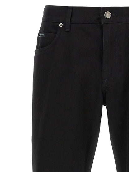 Jeans by Dolce & Gabbana for men in denim cotton black features an sartorial straight-leg and long with a cut for a sartorial finish.