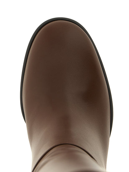 Over-The-Knee Boots by Gianvito Rossi for women in bos taurus calfskin leather brown features an avant-garde Women's Bos Taurus Calfskin Leather Over-The-Knee Boots silhouette, defined by a sophisticated block-heel and a avant-garde .
