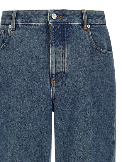 Jeans by Valentino Garavani for men in cotton denim blue presents a tailored silhouette, showcasing a tailored straight-leg and long cut with a refined mid rise for a truly tailored aesthetic.