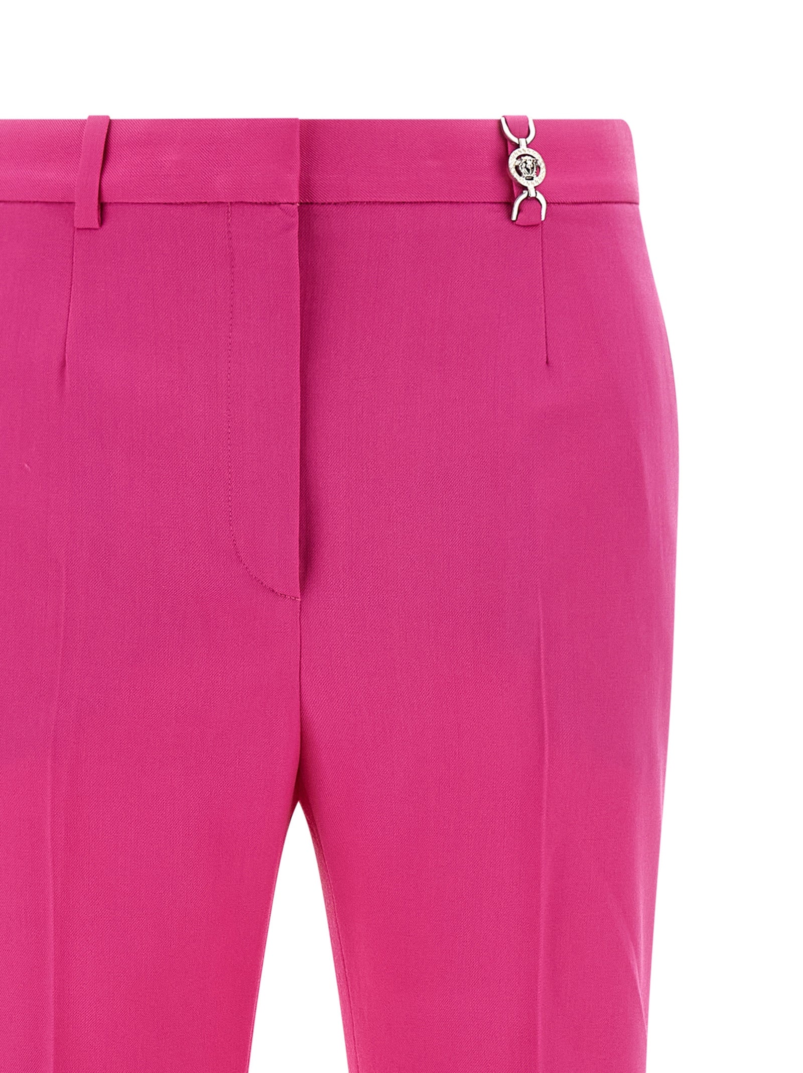 Trousers by Versace for women in virgin wool fuchsia presents a perennial silhouette, meticulously tailored with a straight-leg & flared cut, long finish, and an elegant .