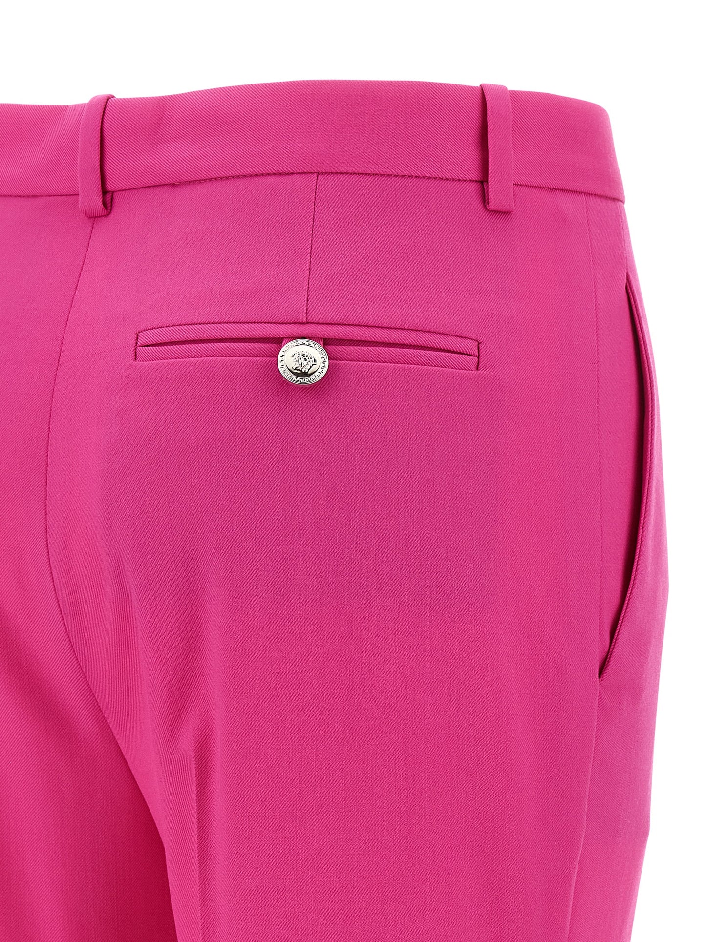 Trousers by Versace for women in virgin wool fuchsia presents a smart silhouette, meticulously detailed with a smart straight-leg & flared, a smart long, and a smart .