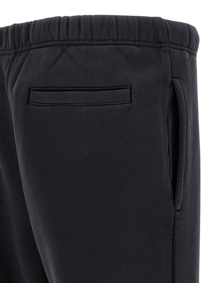 Joggers by PURPLE for men in cotton black & purple features a refined silhouette with a refined straight-leg & wide, defined by a and a refined long for a refined finish.