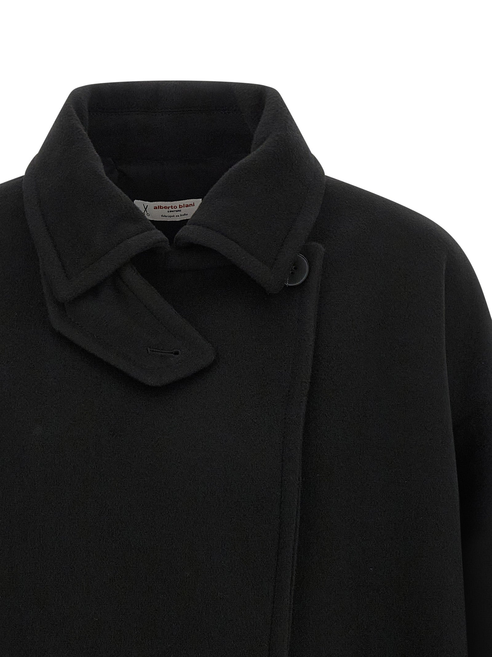 Trench Coat by Alberto Biani for women in virgin wool black presents an sculptural silhouette, artfully detailed with a sculptural shirt-collar neckline and functional for a truly sculptural finish.