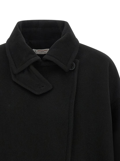 Trench Coat by Alberto Biani for women in virgin wool black presents an sculptural silhouette, artfully detailed with a sculptural shirt-collar neckline and functional for a truly sculptural finish.