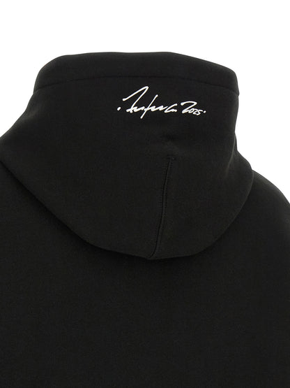 Sweatshirt Hoodie by Kenzo for women in cotton black & print features an avant-garde silhouette, showcasing a sophisticated and detail for a truly avant-garde finish.