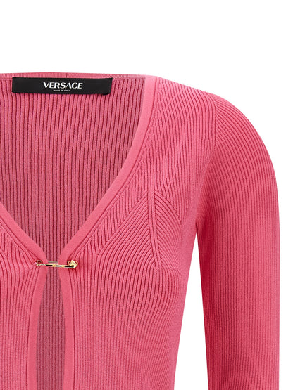 Cardigan by Versace for women in polyester & viscose fuchsia features an impeccable silhouette, showcasing a sophisticated v-neck neckline and detail for a truly impeccable finish.