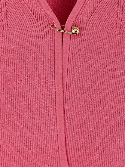 Cardigan by Versace for women in polyester & viscose fuchsia showcases a captivating silhouette, artfully detailed with a captivating and for a truly sophisticated captivating look.