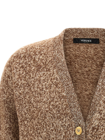 Cardigan by Versace for women in silk virgin cashmere wool beige features a dramatic silhouette, showcasing a sophisticated v-neck neckline and dramatic detail for a timeless, premium look.