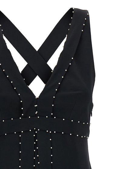 Dress by Giovanni Bedin for women in silk & acetate black & pearl features a dramatic silhouette, showcasing an elegant v-neck neckline and that flows into a dramatic short mini.
