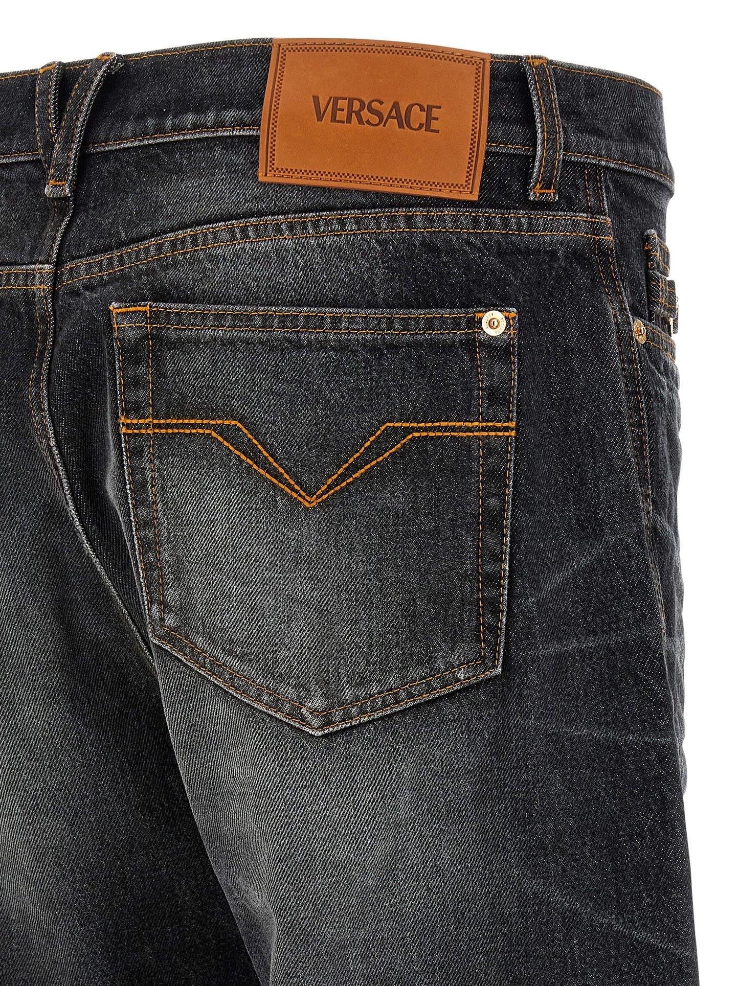 Jeans by Versace for men in denim cotton black & signature features an refined tailoring silhouette, showcasing a premium straight-leg with a and long cut for a refined tailoring look.
