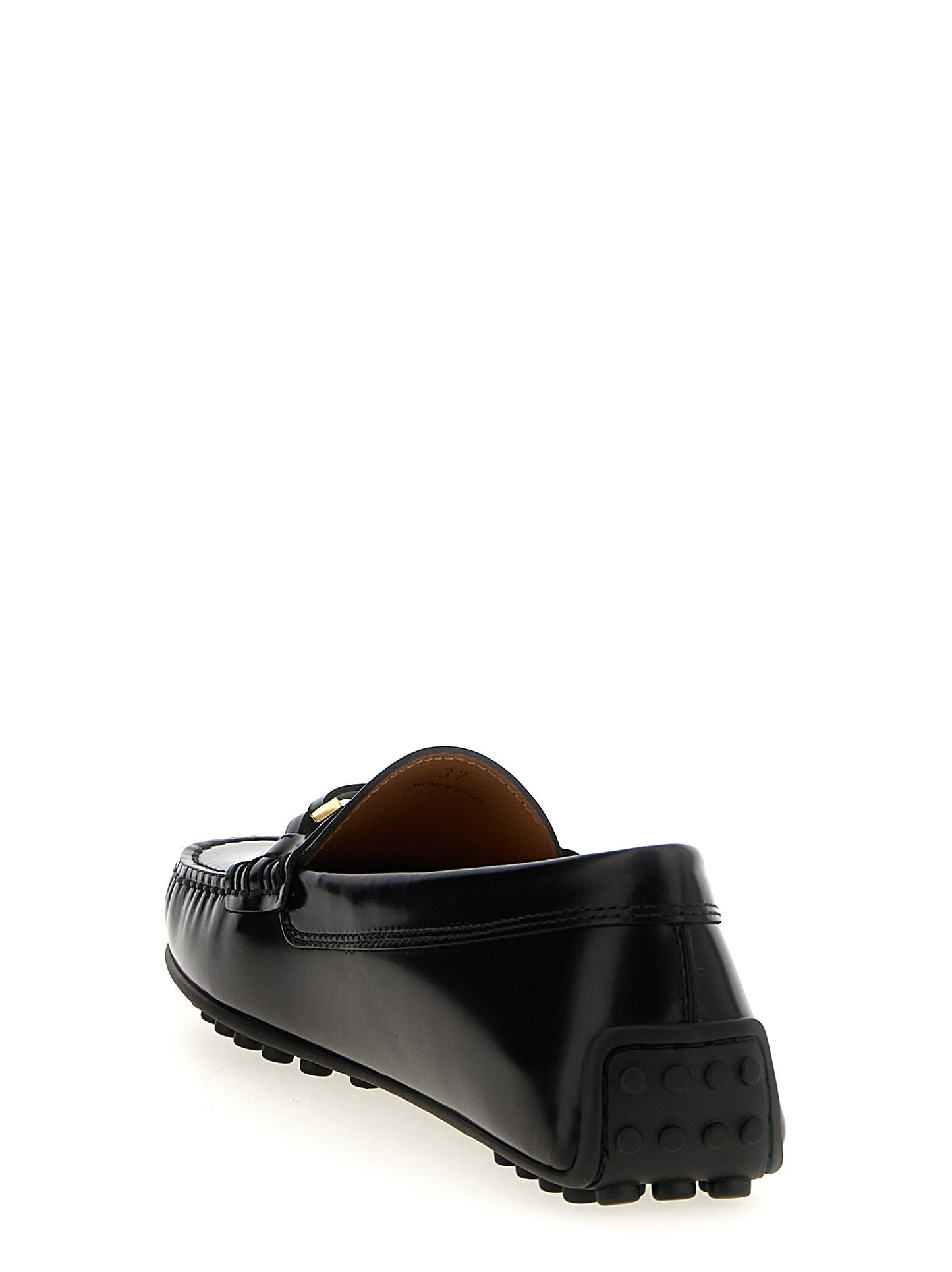 Flat Loafer Slip-On Strap Shoes by Tod's for women in calfskin leather black showcases a impeccable silhouette as City Women's Calfskin Leather Flat Loafer Slip-On Strap Shoes, artfully designed with a impeccable flat and refined for a impeccable finish.