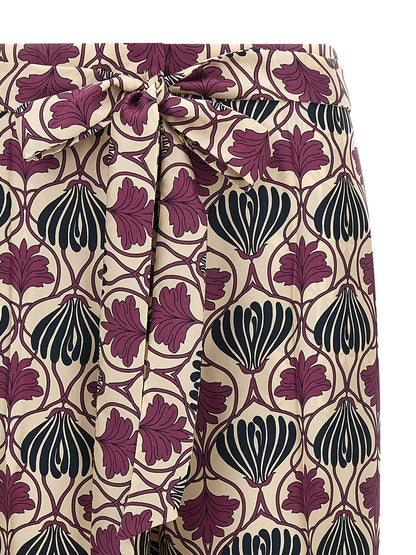 Trousers by Max Mara for women in silk purple & print features an sartorial silhouette, showcasing a precise straight-leg & cropped and cropped with a sartorial for a refined look.