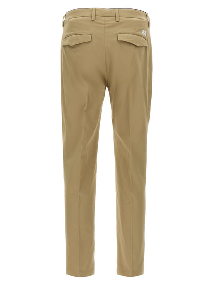 Trousers by Department 5 for men in stretch cotton beige presents a perennial silhouette, meticulously tailored with a cropped cut, cropped finish, and an elegant .