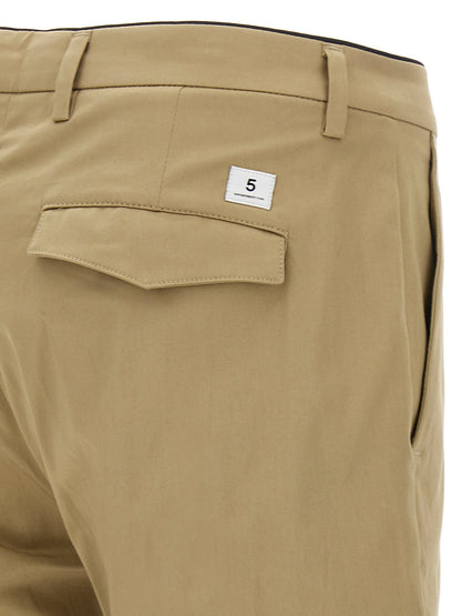Trousers by Department 5 for men in stretch cotton beige presents a smart silhouette, meticulously detailed with a smart cropped, a smart cropped, and a smart .