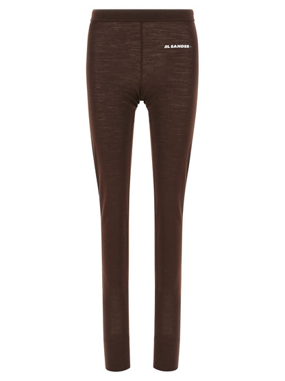 Activewear Leggings by Jil Sander for women in polyester & virgin wool bordeaux & print features a contemporary silhouette, showcasing advanced with a contemporary leggings, long, and .