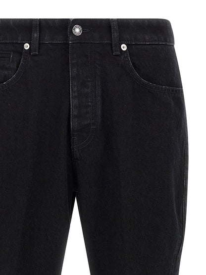 Jeans by Givenchy for men in stretch denim cotton & suede leather black presents a refined pantology silhouette, artfully defined by a refined pantology straight-leg, long, and a sophisticated .