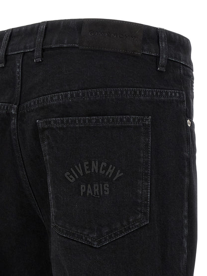 Jeans by Givenchy for men in stretch denim cotton & suede leather black presents a tailored silhouette, showcasing a tailored straight-leg and long cut with a refined for a truly tailored aesthetic.