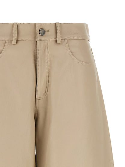 Pants by Haikure for women in lamb leather beige showcases a unrivaled comfort silhouette, featuring a straight-leg & wide cut and long with a high rise for a unrivaled comfort and refined aesthetic.