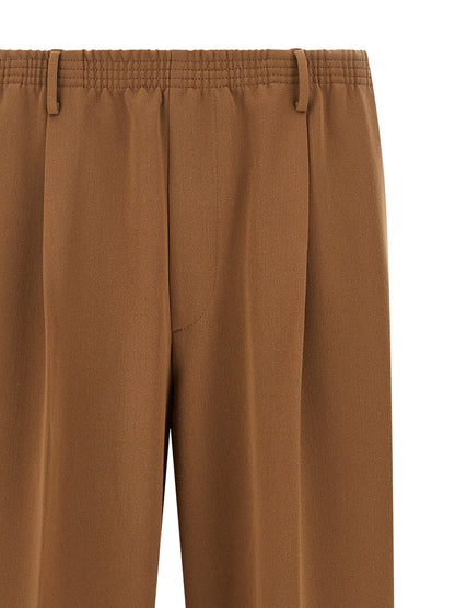 Trousers by CELLAR DOOR for men in stretch viscose polyester brown presents a perennial silhouette, meticulously tailored with a straight-leg cut, long finish, and an elegant .