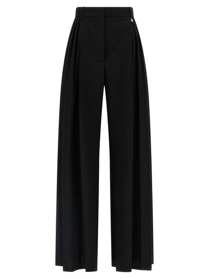 Trousers by Giuseppe Di Morabito for women in canvas & virgin wool black presents a perennial silhouette, meticulously tailored with a wide cut, long finish, and an elegant high rise.