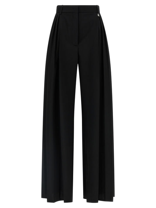 Trousers by Giuseppe Di Morabito for women in canvas & virgin wool black presents a perennial silhouette, meticulously tailored with a wide cut, long finish, and an elegant high rise.