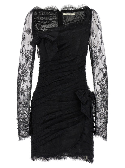Dress by Alessandra Rich for women in organic cotton & polyamide black & transparent features an magnificent silhouette, artfully detailed with a magnificent plunging neckline and long-sleeve that flows into an magnificent short mini.