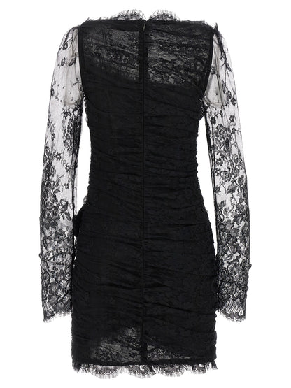 Dress by Alessandra Rich for women in organic cotton & polyamide black & transparent presents a sinuous silhouette, showcasing a sophisticated plunging neckline and detailed with a sinuous short mini for a refined finish.