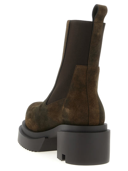 Ankle Strap Boots by Rick Owens for men in suede calfskin leather brown features an enchanting design from the Men's Suede Calfskin Leather Ankle Strap Boots collection, highlighting a enchanting and for a refined look.