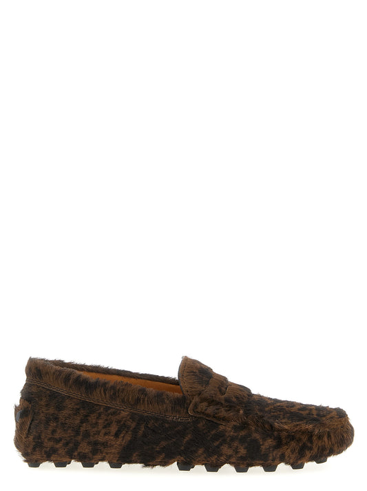 Flat Loafer Slip-On Shoes by Tod's for women in calfskin leather brown features an dynamic silhouette from the Pony Women's Calfskin Leather Flat Loafer Slip-On Shoes collection, defined by a dynamic and flat for a dynamic look.